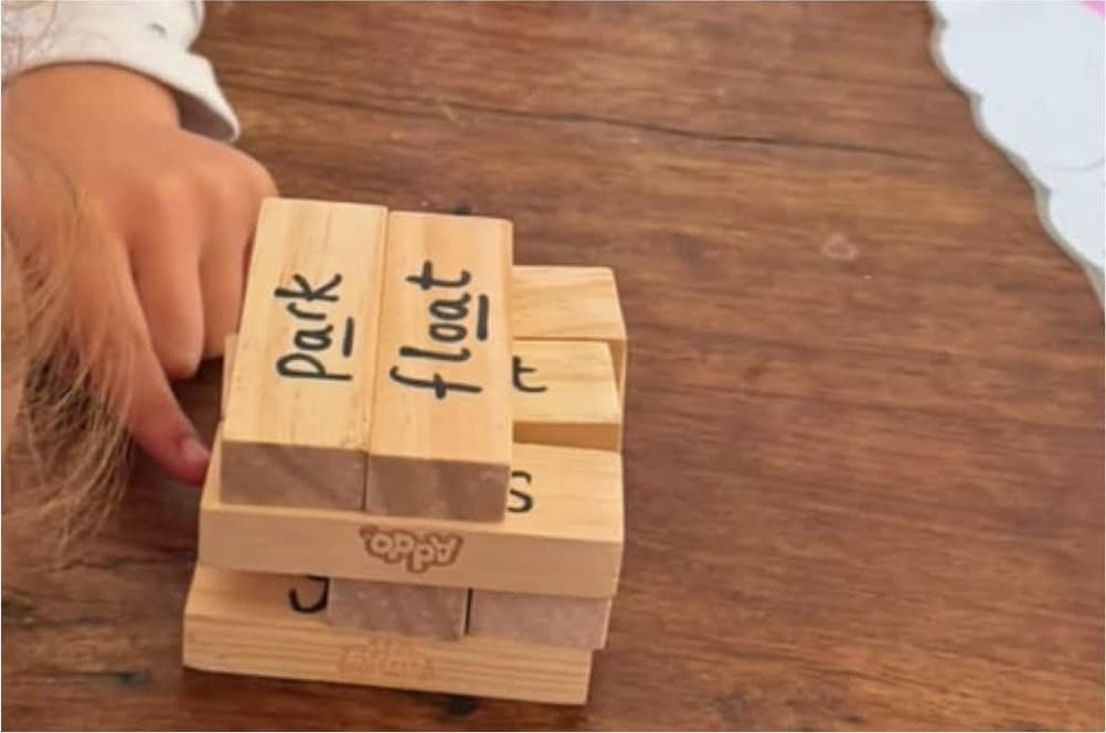 Spelling words with wooden blocks